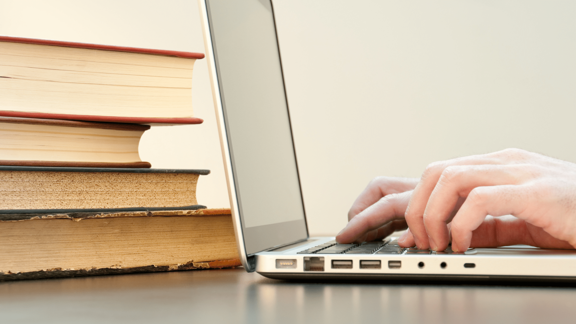A student with laptop and books to start studying for the MCAT.