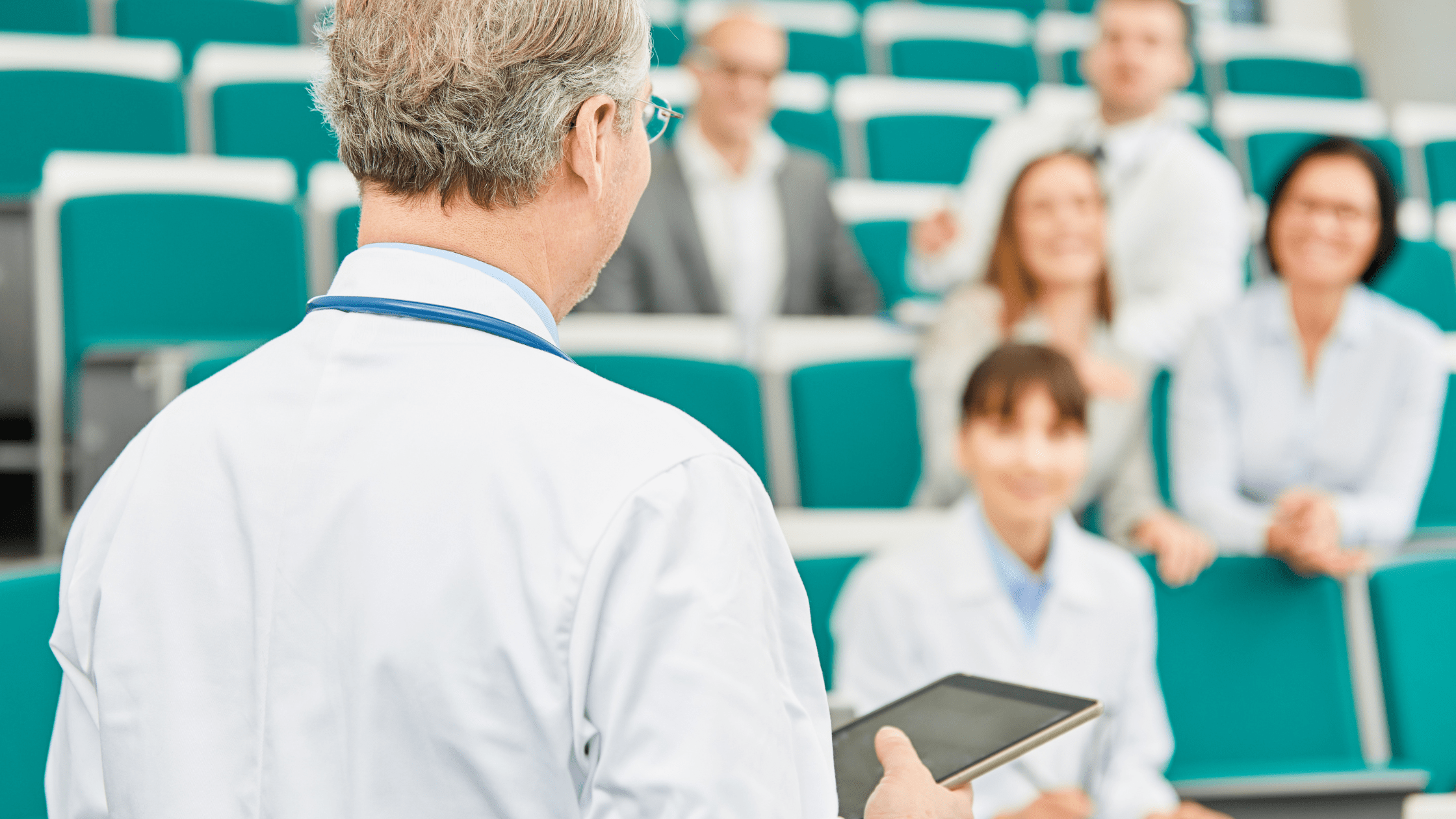 A group of medical school students in a classroom.