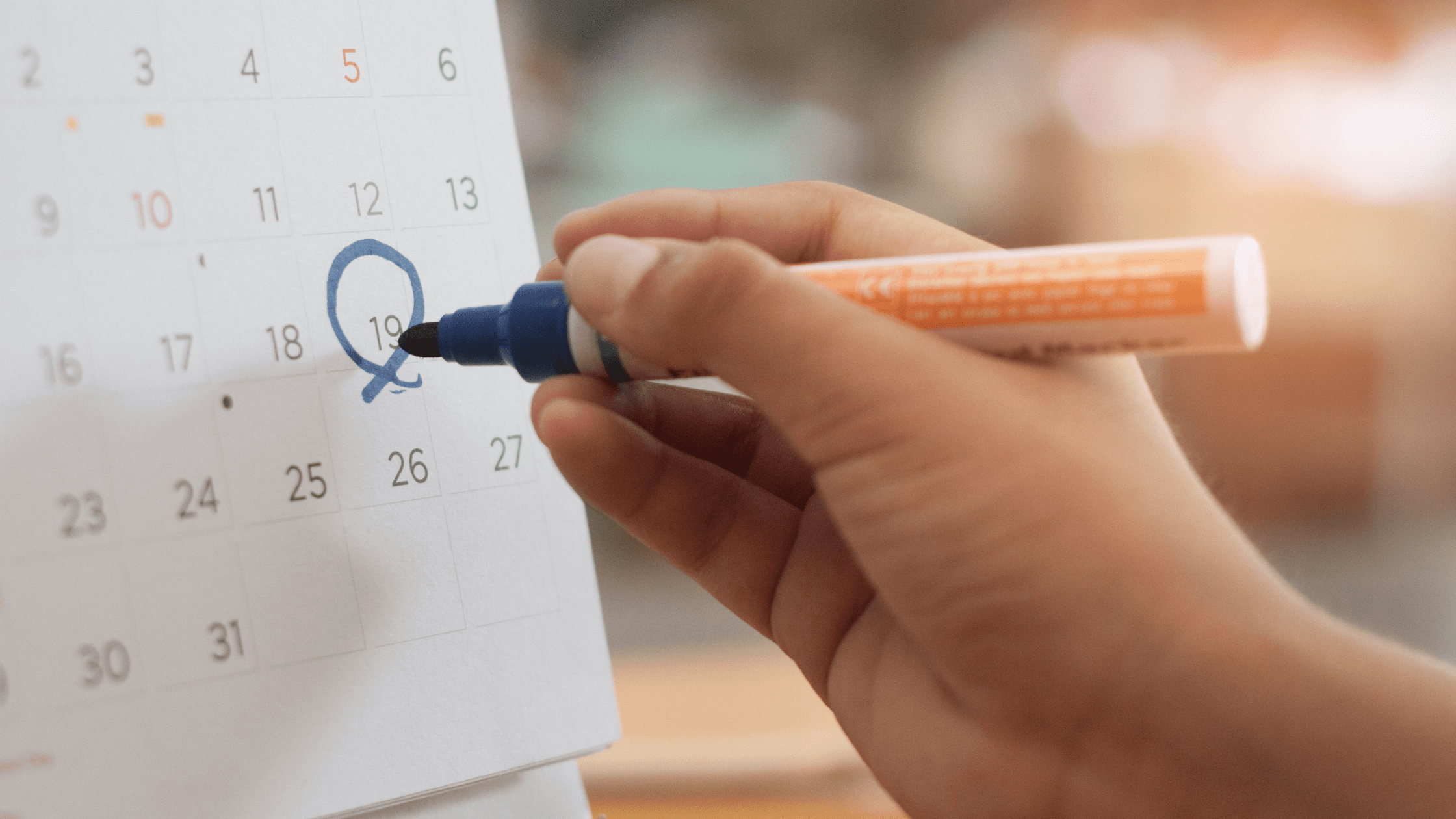 A pre-med student circling their MCAT test date on their calendar.