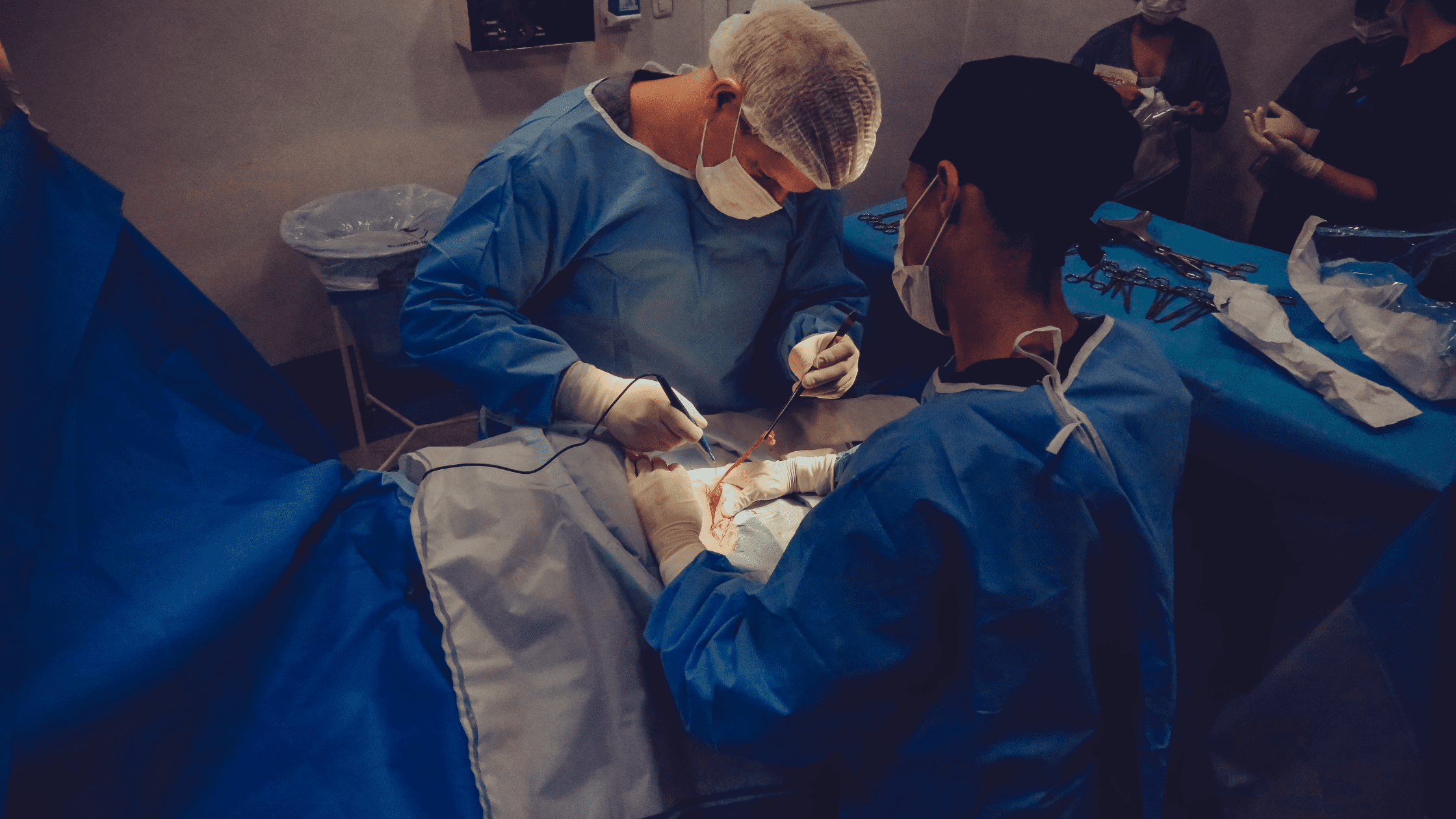 Vascular surgery residents assisting in surgery.