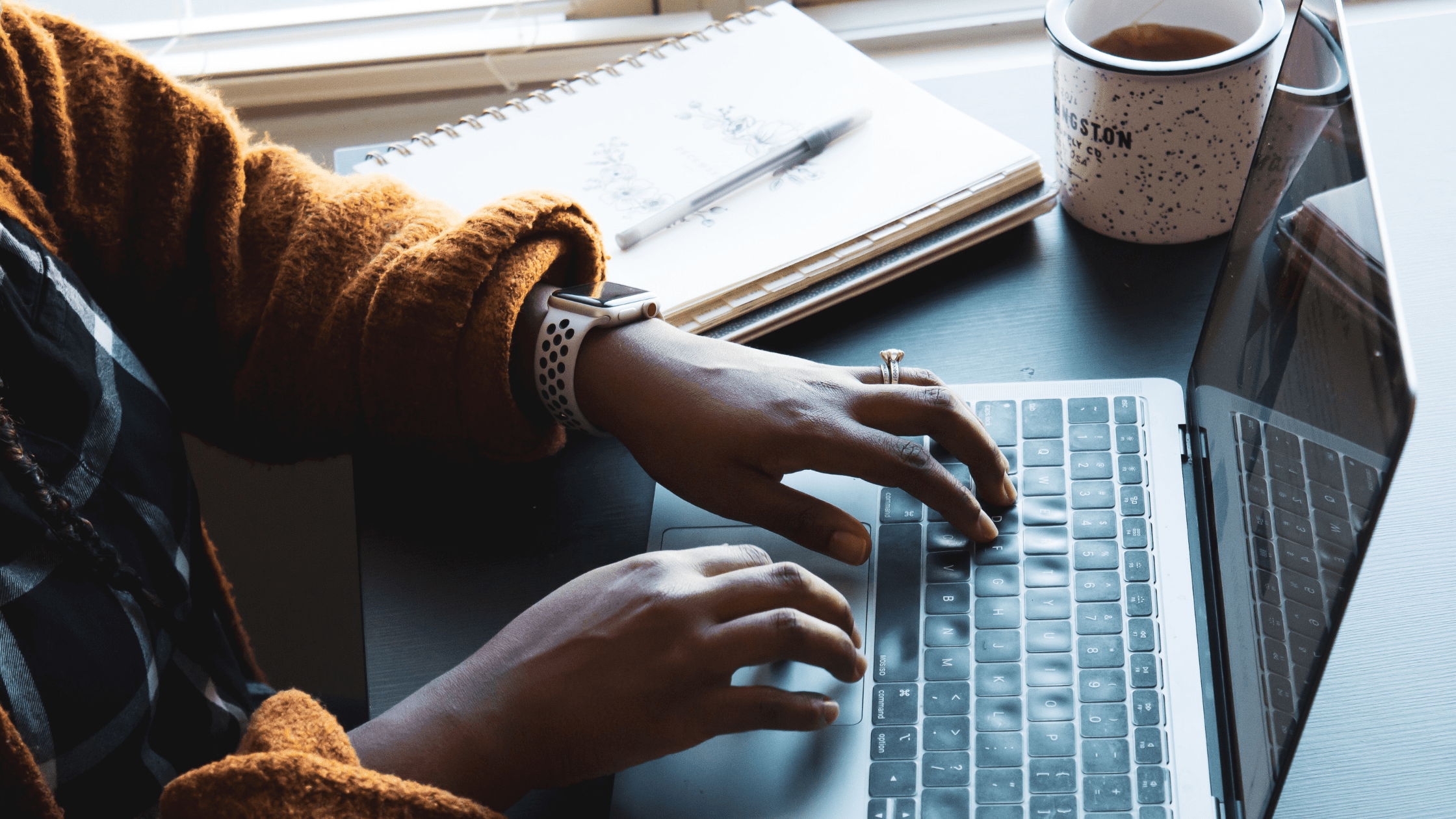 A student typing on computer and using study tips for MCAT